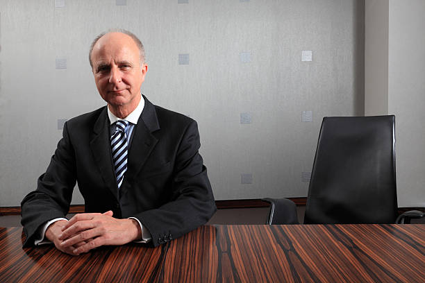 istock businessman sitting at meeting table 531263517