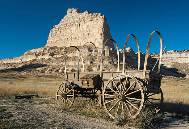 Scotts Bluff National Monument Scotts Bluff National Monument is located in western Nebraska.   Eagle Rock which was used as a landmark to the early pioneers on there way west. Mitchell pass is where the Oregon Trail crosses between Eagle Rock and Sentinel Rock. This Conestoga wagon is an example of the transportation that the early pioneers used on the journey west. eagle rock stock pictures, royalty-free photos & images