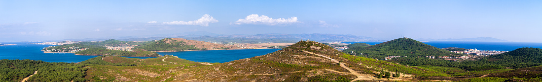 Panoramic view of environment with sea and hills.