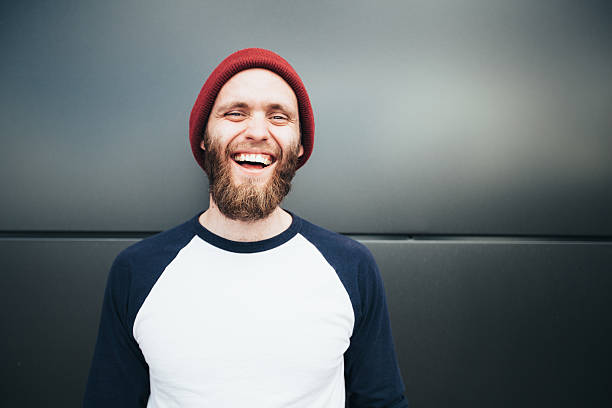 istock Hipster man smiling and wearing a hat 531264450