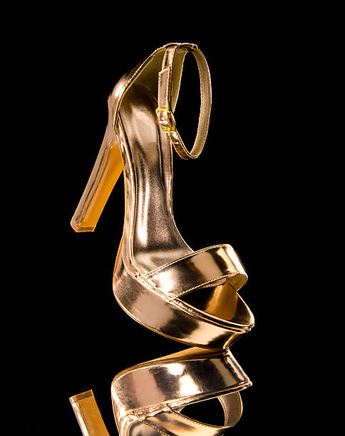 Women's gold-colored High Heels shoe stock photo