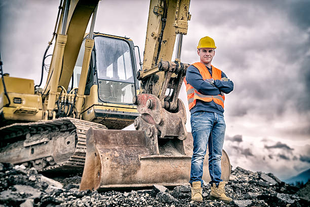 digger conductor de tierra - pesado fotografías e imágenes de stock