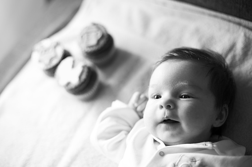 Black and white portrait of laughing baby