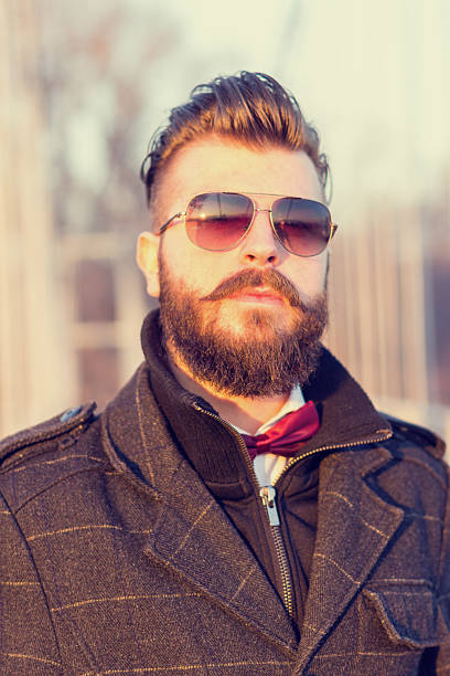istock Hipster man portrait outdoors. Man is looking at camera 531267101
