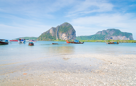 Beach and tropical sea with long-tail boat in thailand