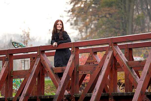 Free Stock Photo of Woman With Long Hair Standing on Wooden Bridge ...