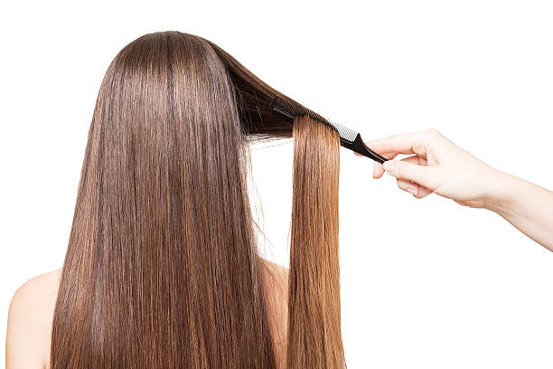 istock Barber combs Hand luxurious long hair isolated on white 531268914