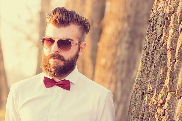 istock Hipster man portrait outdoors. Man is looking at camera 531276403