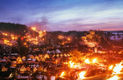 The beautiful Franconian town of Pottenstein illuminated by one thousand fires on the surrounding hillsides. 