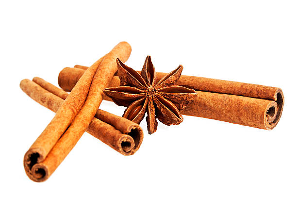 Cinnamon sticks and stars anise isolated on a white background Cinnamon sticks and stars anise isolated on a white background kayu manis stock pictures, royalty-free photos & images