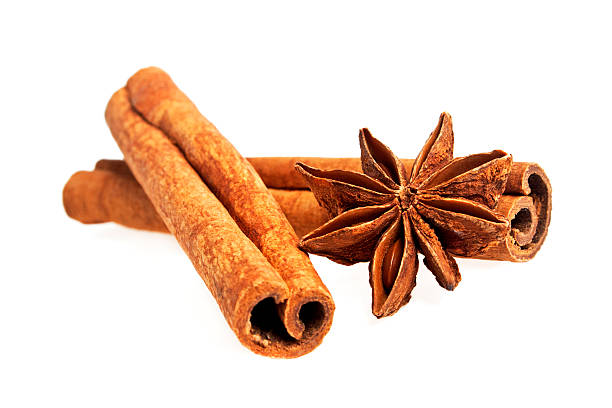 Cinnamon sticks and stars anise isolated on a white background Cinnamon sticks and stars anise isolated on a white background kayu manis stock pictures, royalty-free photos & images