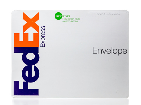 Miami, USA - October 24, 2014: Large white Federal Express earthsmart carbon-neutral shipping envelope.