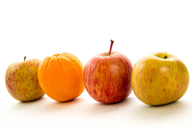 istock line of apples with one orange 531281279