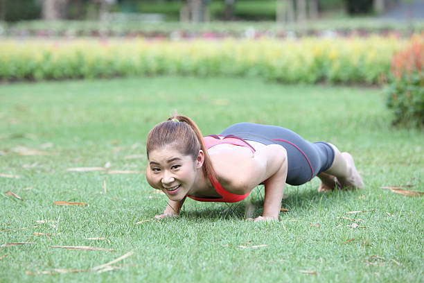 istock Exercise woman doing push ups in outdoor workout training 531282257