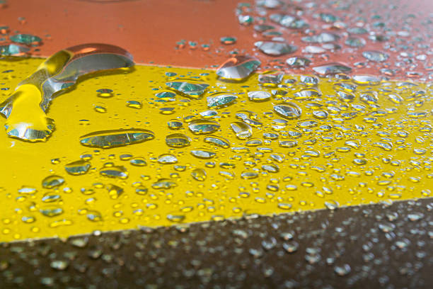 water drops on glass bright abstract background of water drops on glass reflectivity stock pictures, royalty-free photos & images