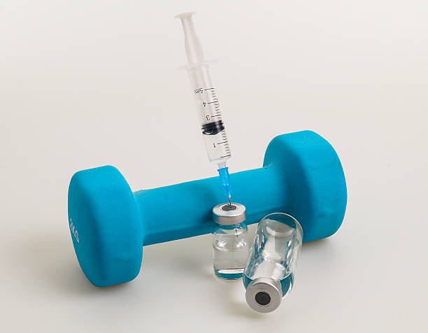 exercise and doping weight exercise and doping with a syringe erythropoietin stock pictures, royalty-free photos & images