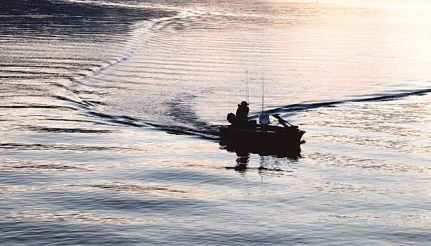 istock silhouette of a fisherman 531295499