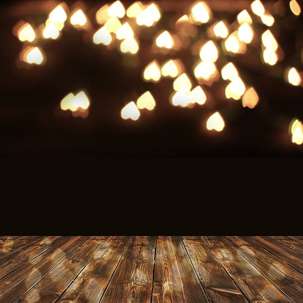 istock wooden deck table over heart bokeh background. Valentine's day 531301053