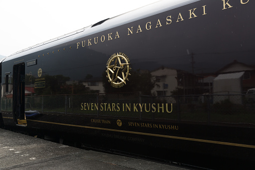 Yufu, Japan - September 2, 2014 : Seven Stars train in Yufuin Station, Oita Prefecture, Kyushu, Japan. The concept of the Seven Stars train is a journey to discover a new way of life.
