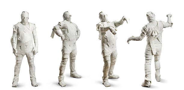 Men in toilet paper Four men in toilet paper isolated on white mummified stock pictures, royalty-free photos & images