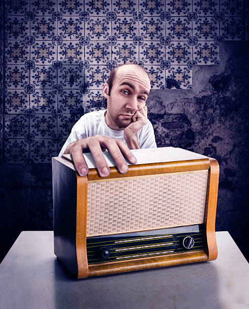 istock Man with vintage radio 531303192