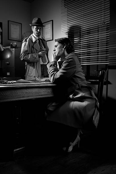 istock Detective interviewing a young pensive woman in his office 531303386
