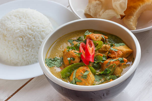 istock Indian green curry with basmati rice and papadums 531305667