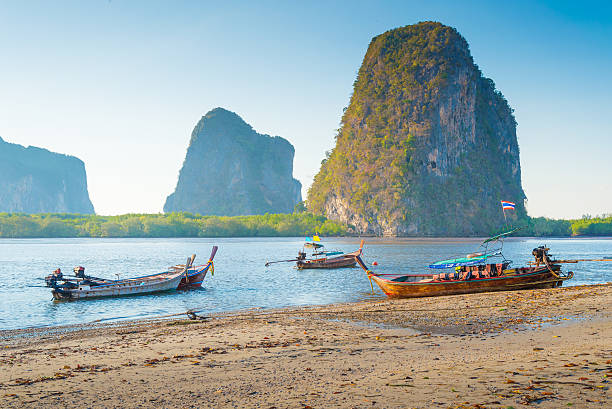 istock Beach and tropical sea with long-tail boat in thailand 531305870