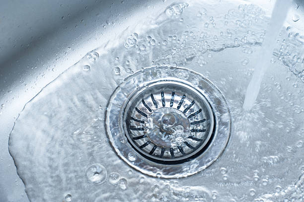 istock New metal sink with water in the kitchen 531306219