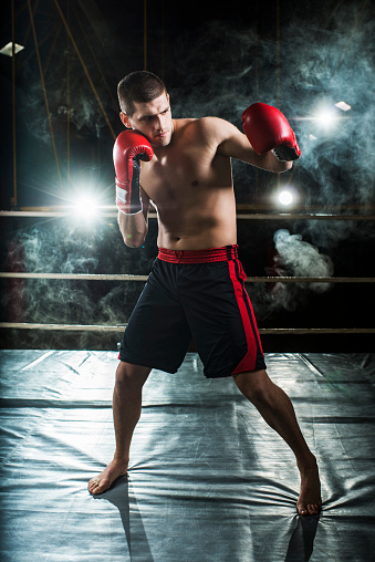 Male boxer in fight stance.  