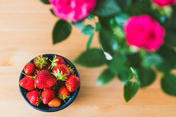 istock bowl of strawberry at table 531308322
