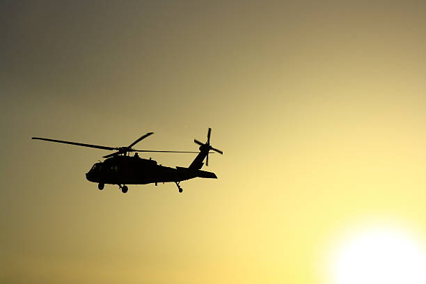 istock Helicopter at sunset with sun view 531311508