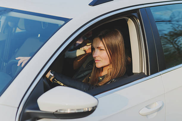 istock beautiful woman driving a car 531312752