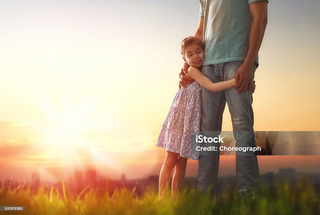 Father and his daughter Happy loving family. Father and his daughter child girl playing and hugging outdoors. Cute little girl hugs daddy. Concept of Father's day. Family Stock Photo