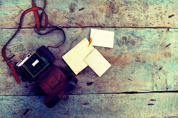 istock Old retro camera on vintage wooden background 531313951