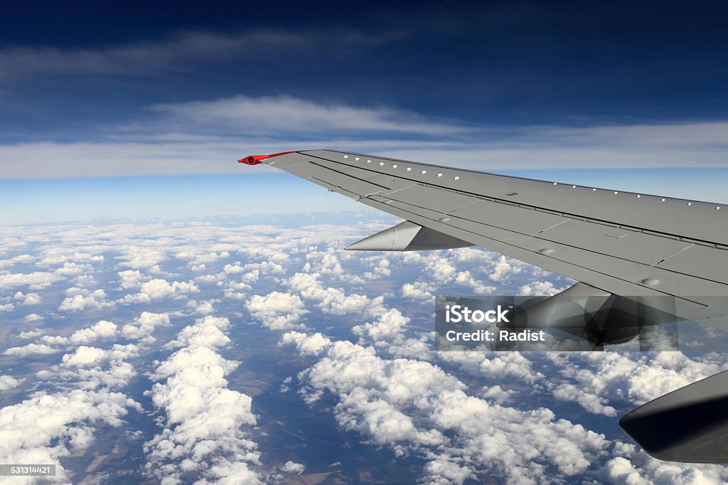 View of wing aircraft View of wing aircraft on the sky background 2015 Stock Photo