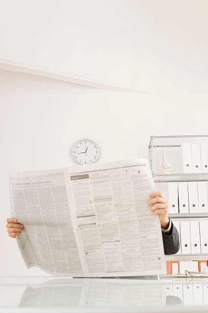 istock Businessman reading newspaper, portrait 531315015