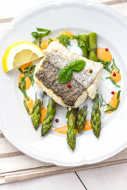 istock Hake fillet with asparagus foam sauce 531315114