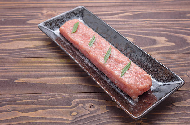 istock Raw marinated meat pork chop in a black plate 531315304