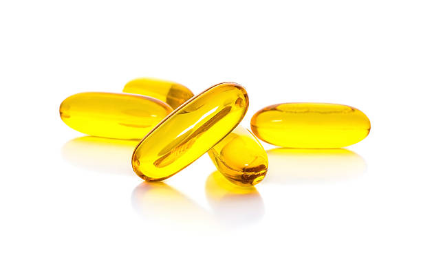istock Fish oil capsules isolated on white background 531316275