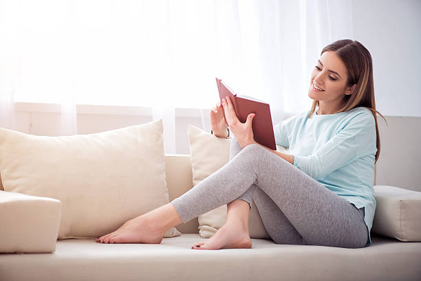 istock Positive woman reading book 531316702