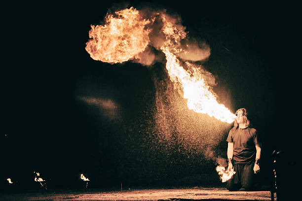 istock active European guy carries out tricks for fire show night 531316889