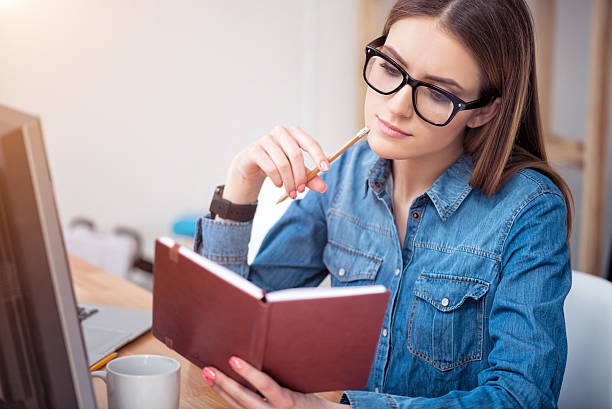 istock Concentrated woman sitting at the table 531319070