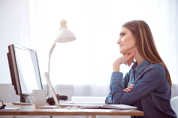 istock Positive woman sitting at the table 531319766