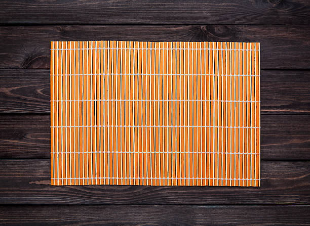 istock bamboo mat on a wooden table, top view 531319996
