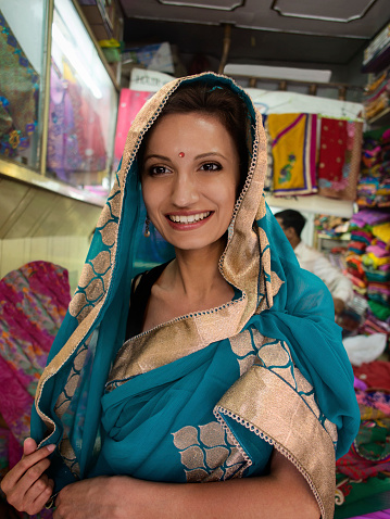 Woman wearing sari at Taj Mahal..