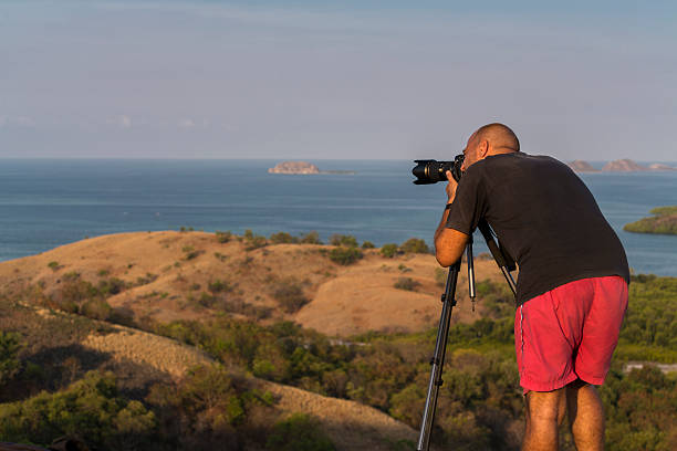istock Landscape male photographer in action 531321063