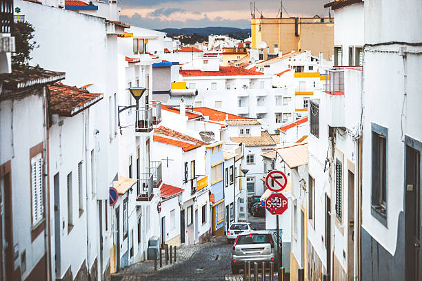 Streets of Lagos town. Hillside street and white buildings in old town. lagos portugal stock pictures, royalty-free photos & images