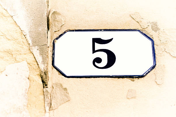 istock Number 5 Ceramic Street Address Tile on Old Tan Wall 531323012
