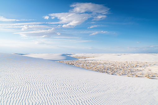 White Sands National Monument Desert Dunes. View over the beautiful white sandy desert dunes of White Sands National Monument ti the horizon under blue summer sky., New Mexico, USA.